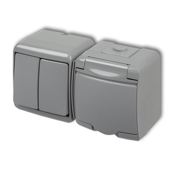 KARLIK JUNIOR 10WGHH-2p Łącznik świecznikowy z gniazdem pojedynczym z uziemieniem 2P+Z (klapka popielata; przesłony torów prądowych)