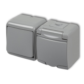 KARLIK JUNIOR 10WGHH-1 Łącznik jednobiegunowy z gniazdem pojedynczym z uziemieniem 2P+Z (klapka popielata; bez przesłon)