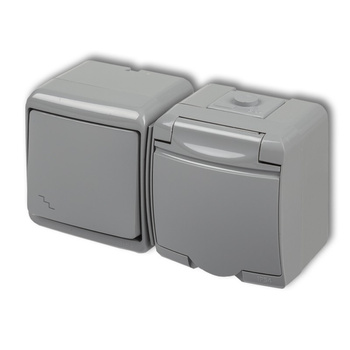 KARLIK JUNIOR 10WGHH-3p Łącznik schodowy z gniazdem pojedynczym z uziemieniem 2P+Z (klapka popielata; przesłony torów prądowych)